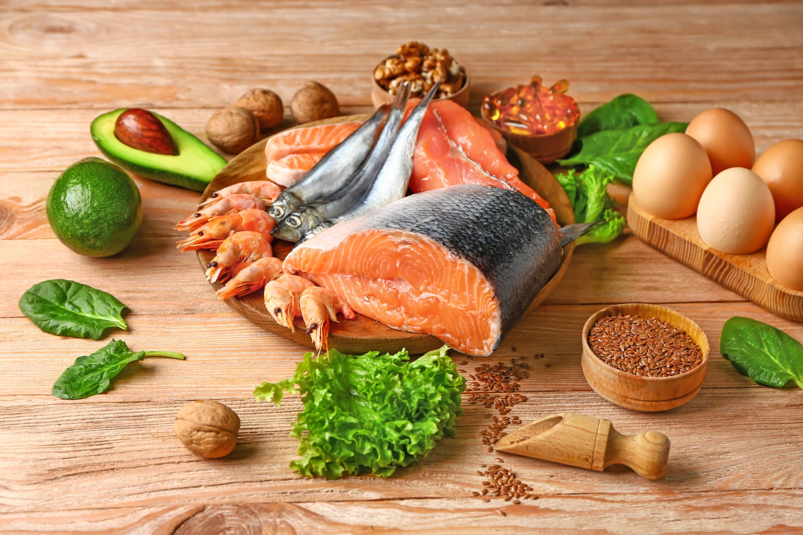 Healthy products rich in omega-3 on wooden background